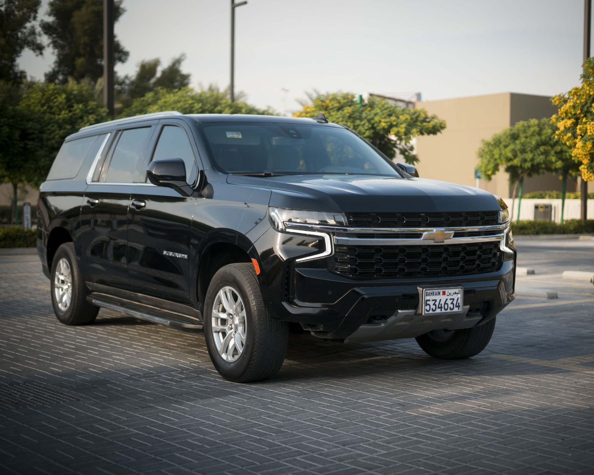 Luxury black GMC SUV providing limousine from Kuwait to Dammam Airport